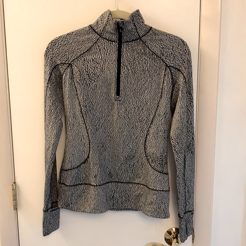 Lululemon size 4 long sleeve 1/4 zip jacket. Black and white heather print.